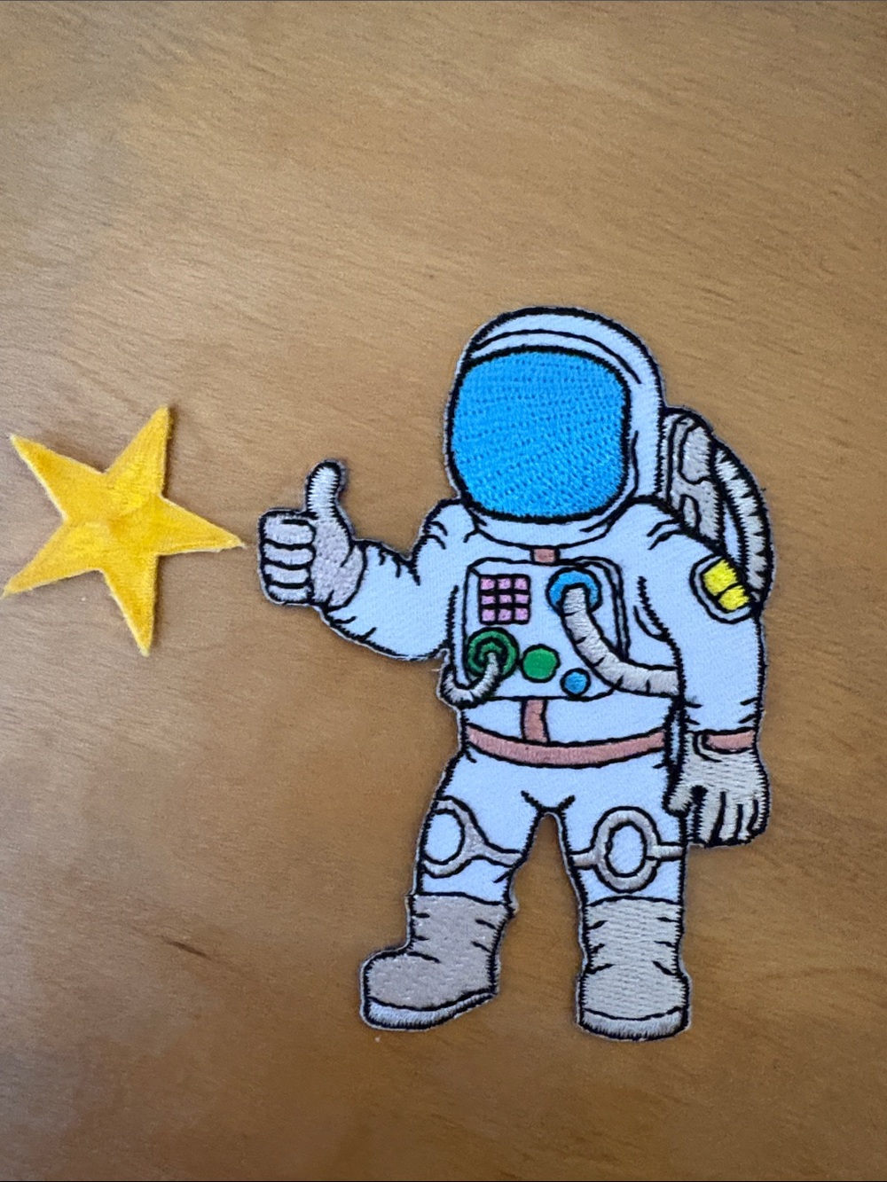 Blue-Visored Astronaut Iron-On Patch with Yellow Star